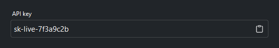 Read-only API key field with a trailing copy button — dark theme